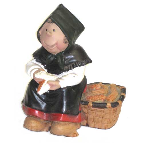 imagen figura personaje Telva sentada con panollas