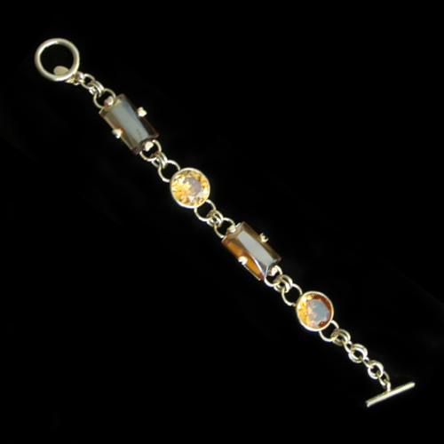 Imagen pulseras plata chapadas en oro con piedras de topacio